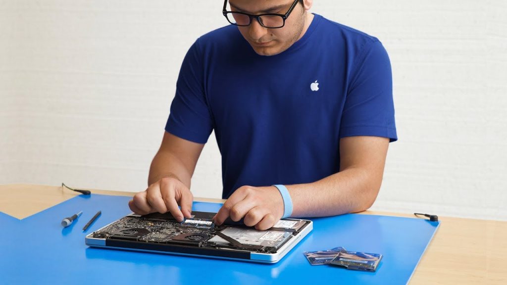 An Apple Genius performing a repair on MacBook Pro 15"